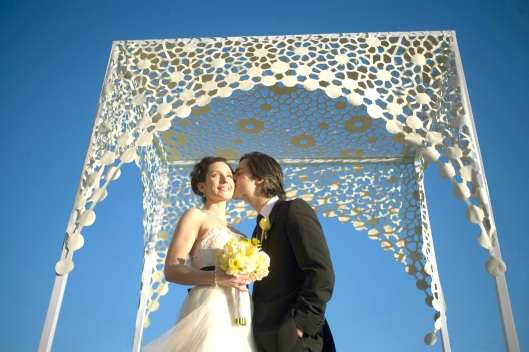 A chuppah or any nonJewish marriage canopy transforms the space below into 